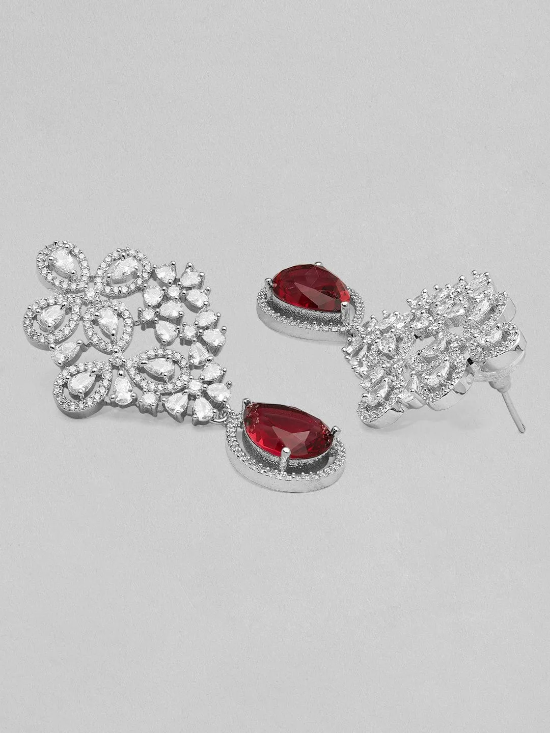 Rubans silver plated earrings with studded american diamonds and red stones.